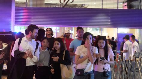 Shooting at a major Bangkok shopping mall kills at least 2, and a suspect is in police custody